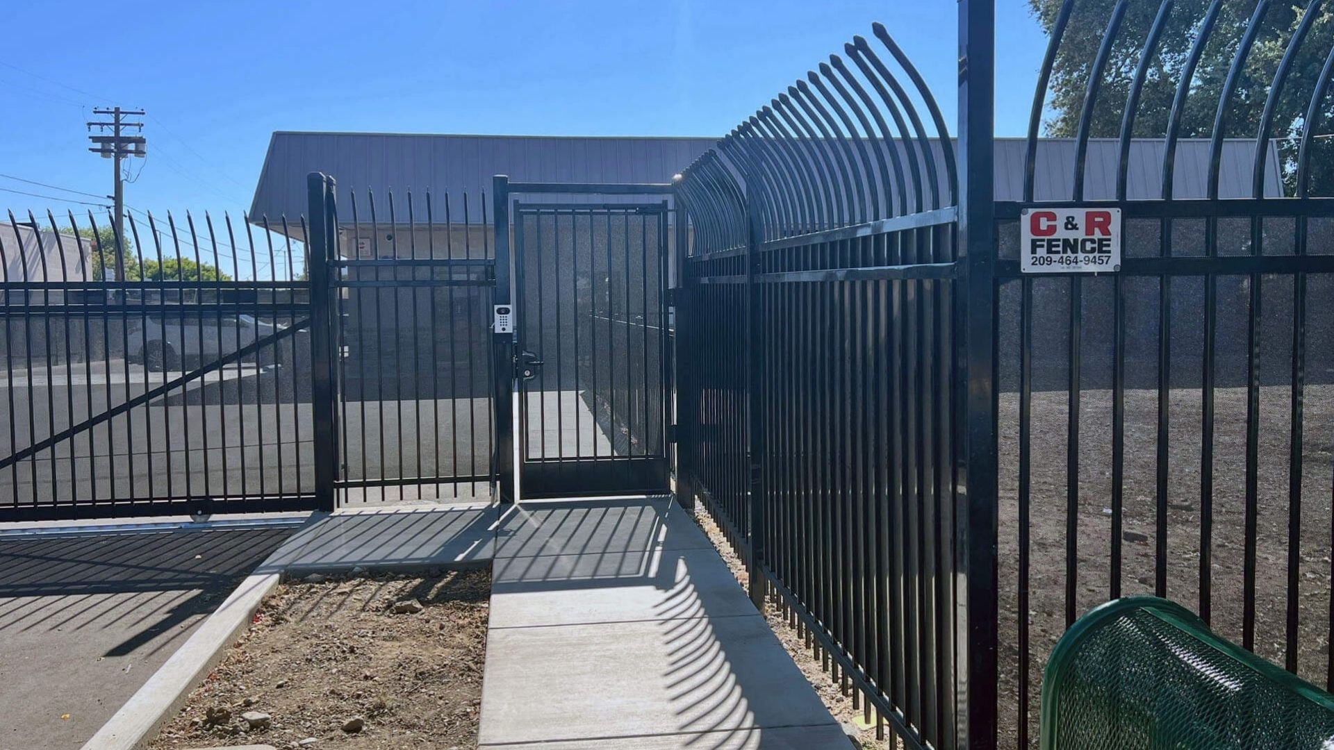 Automatic pedestrian gate and iron security fencing at Hannah’s House in Modesto