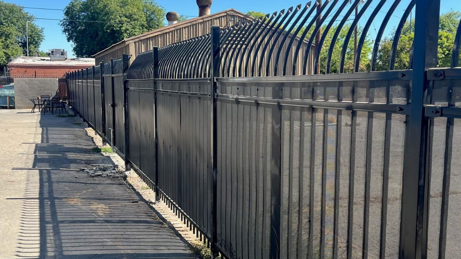 Close view of iron security fencing with curved pickets at Hannah’s House