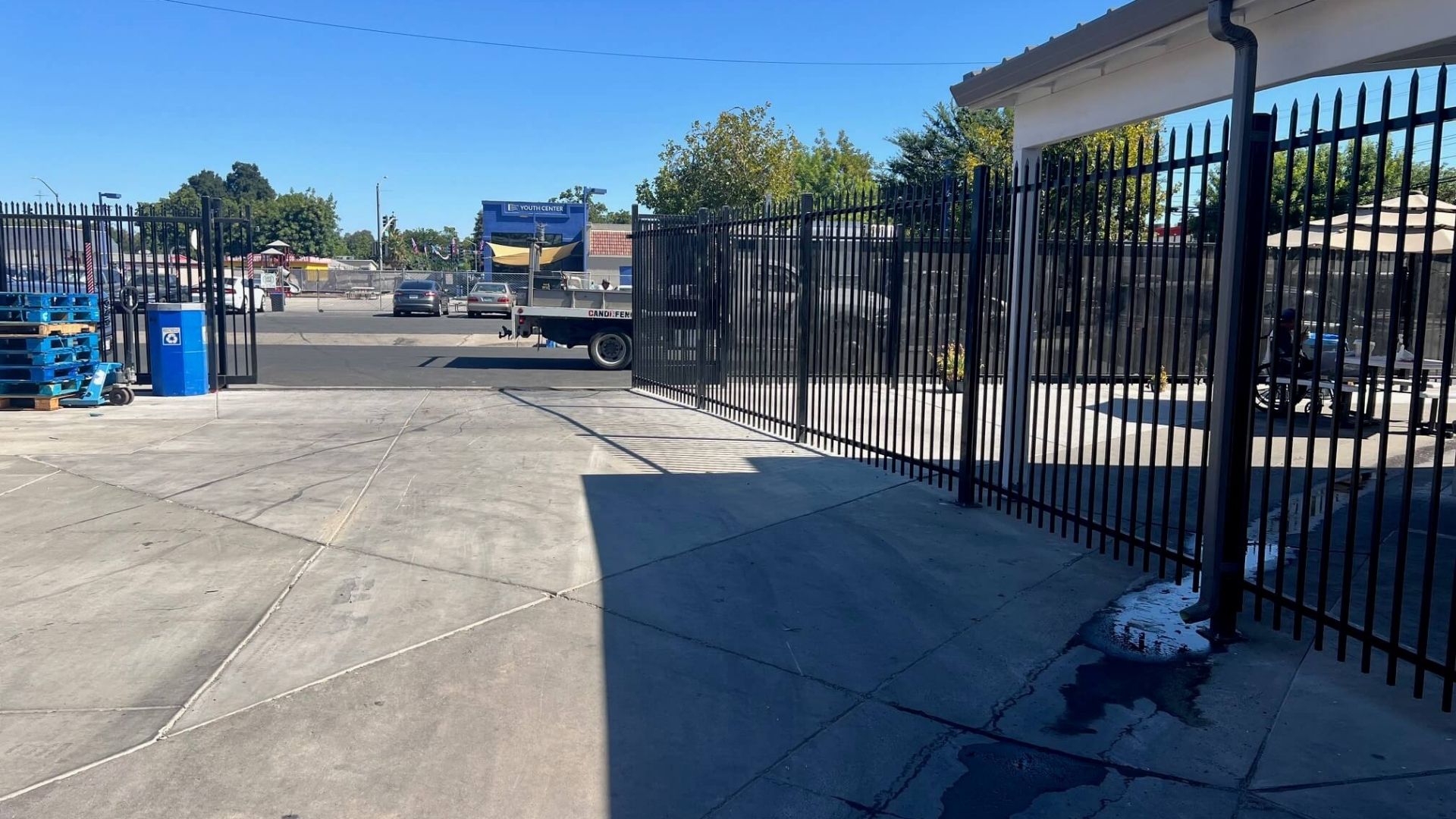 Iron perimeter fence and pedestrian gates at Modesto Gospel Mission in Modesto