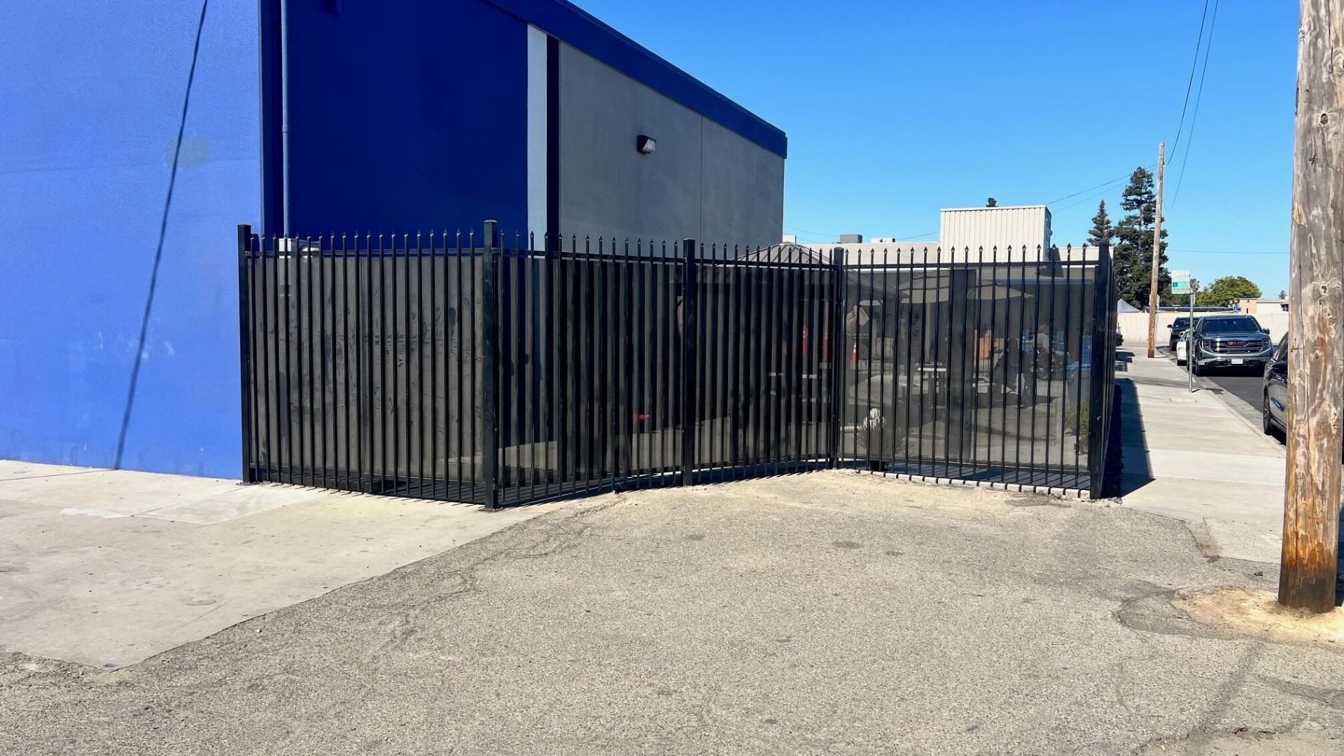 Iron security fencing with privacy screening at Modesto Gospel Mission