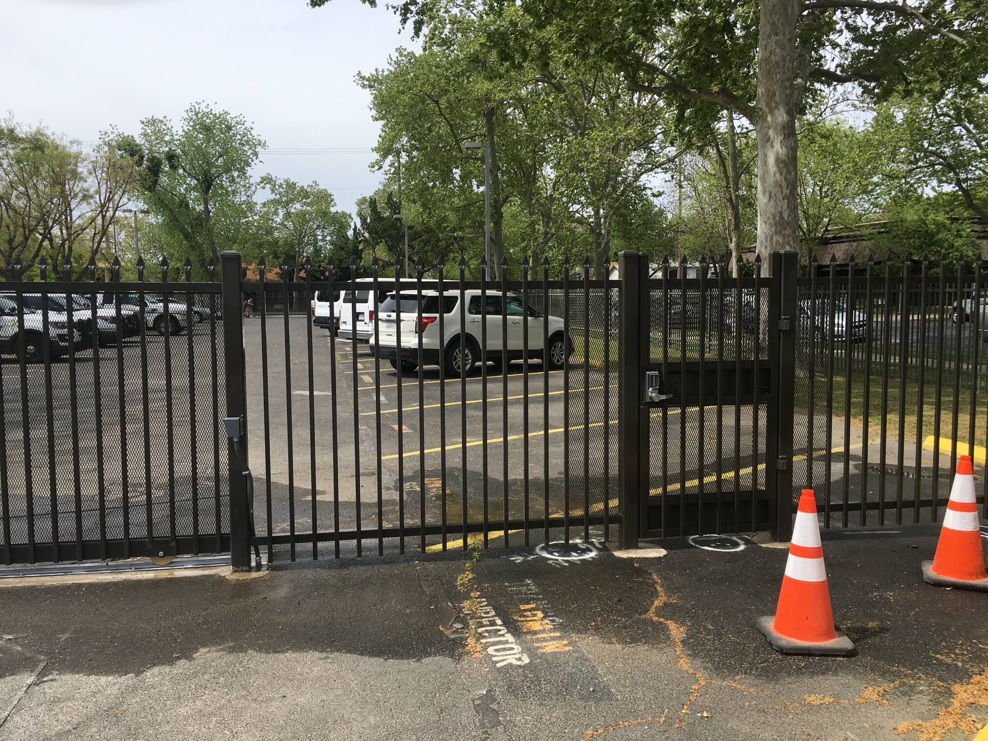Commercial chain link security fence with gate operator at Merced County Sheriff facility